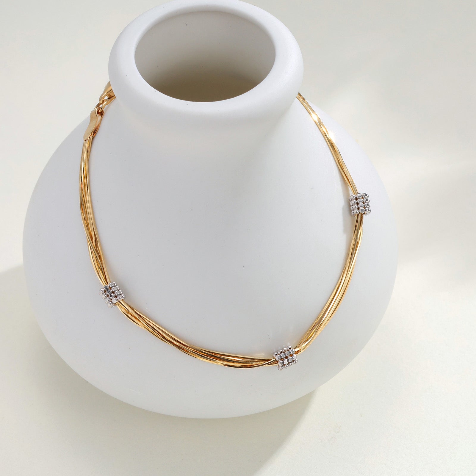 18K Yellow Gold Tassel Twisted Snake Bone Station Bracelet